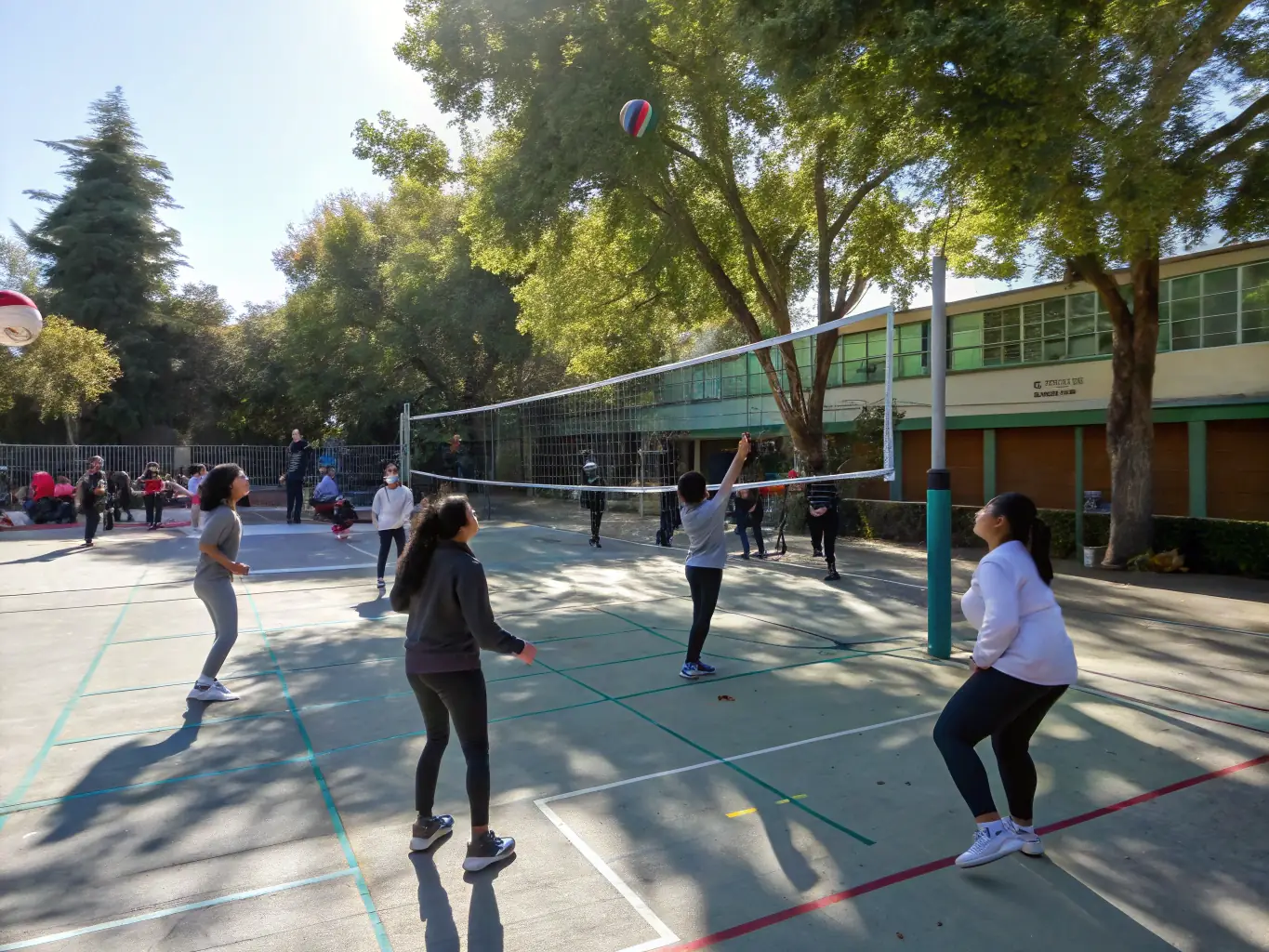 Students participating in a volleyball match, showcasing agility and sportsmanship.