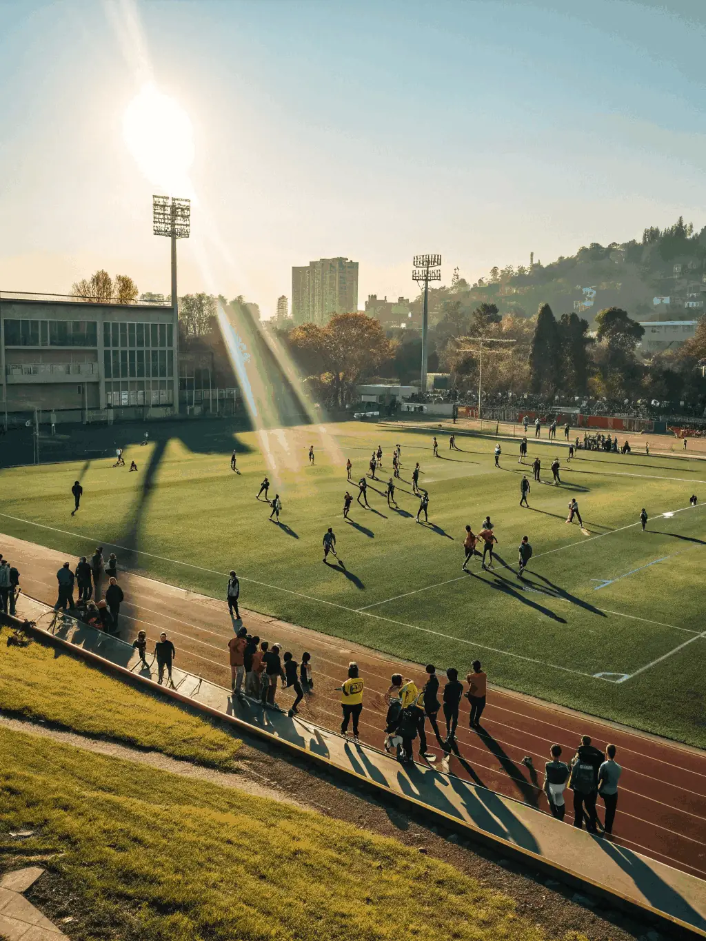 A vibrant image of students participating in a soccer match on a sunny day, showcasing teamwork and enthusiasm.